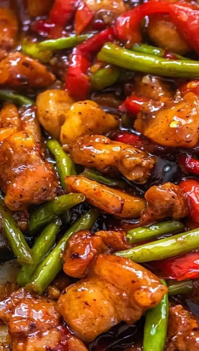 Chicken and green bean stir fry dish with colorful vegetables