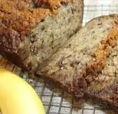 Freshly baked moist banana bread with ripe bananas and nuts