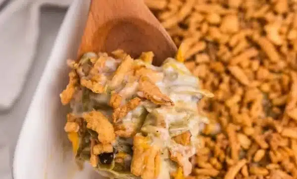 Delicious classic green bean casserole recipe topped with crispy onions.