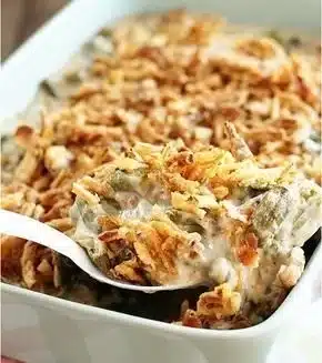 Classic green bean casserole prepared with creamy sauce and crispy onions.