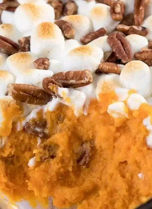 Classic sweet potato casserole topped with pecans and marshmallows