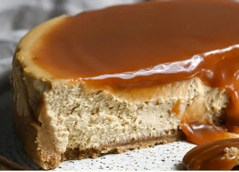 Delicious slices of easy apple cider cheesecake topped with whipped cream