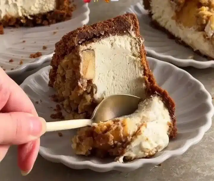 Delicious easy apple crumble cheesecake with apple topping and crumble crust