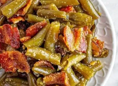 Bowl of easy green beans cooked in chicken broth for a delicious side dish