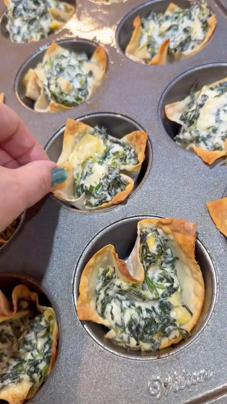 Delicious spinach artichoke wonton cups served as a tasty appetizer.