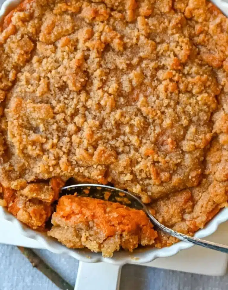 Easy sweet potato casserole with brown sugar topping served in a baking dish