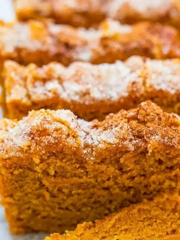 Moist pumpkin bread with a sprinkle of cinnamon sugar on top