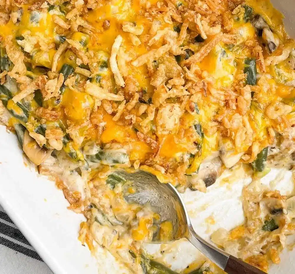 Bowl of Paula Deen's Southern green bean casserole with crispy topping