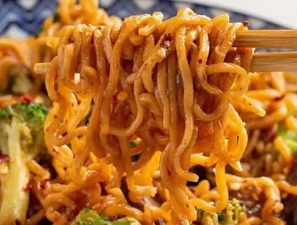Quick beef and broccoli ramen stir fry in a bowl with vegetables